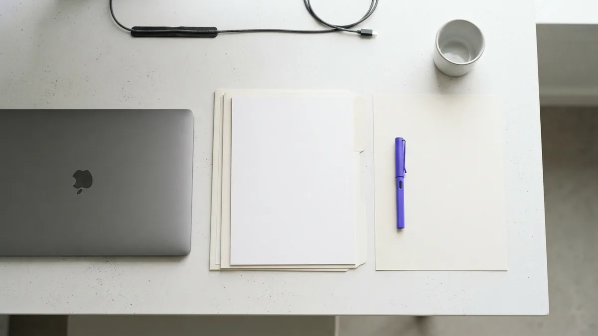 Prepare your startup for funding Blank planning materials and a laptop suggest preparation for a startup funding round