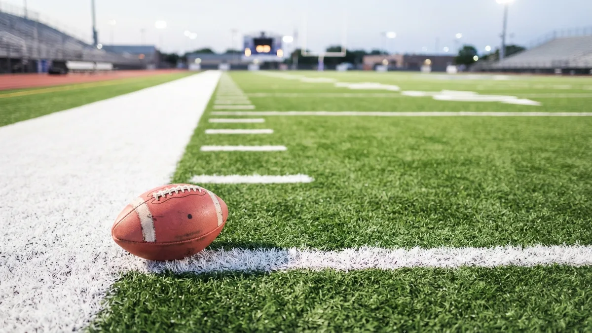 Football near the end zone showing a possible defensive return during a conversion